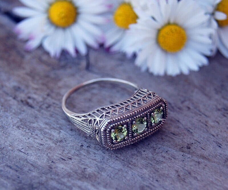 A diamond engagement ring with white daisies