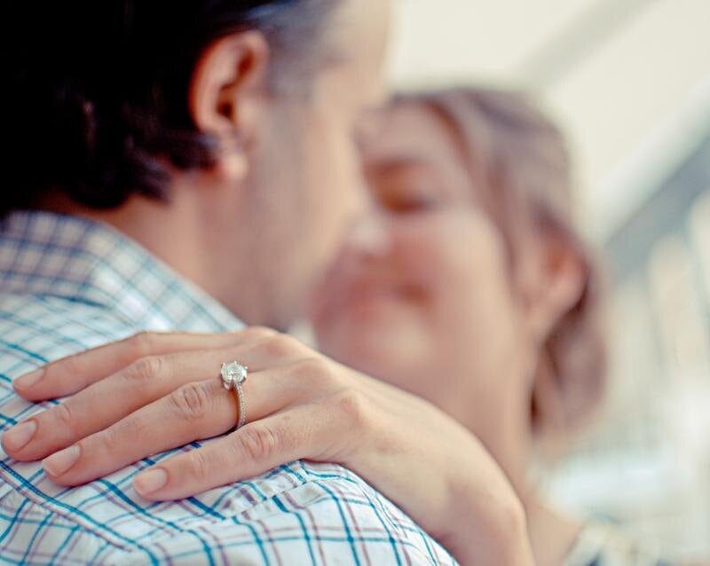 A couple embracing after a marriage proposal