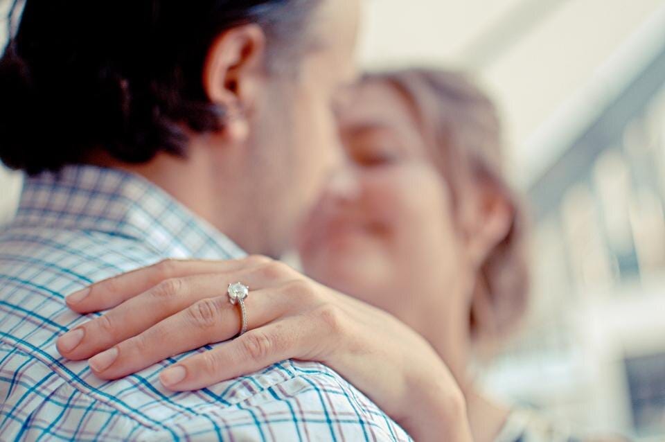 A couple embracing after a marriage proposal