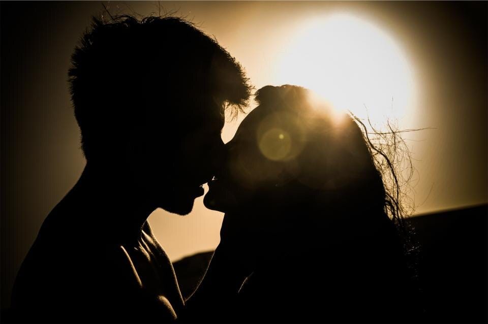 A couple at sunset celebrating their engagement