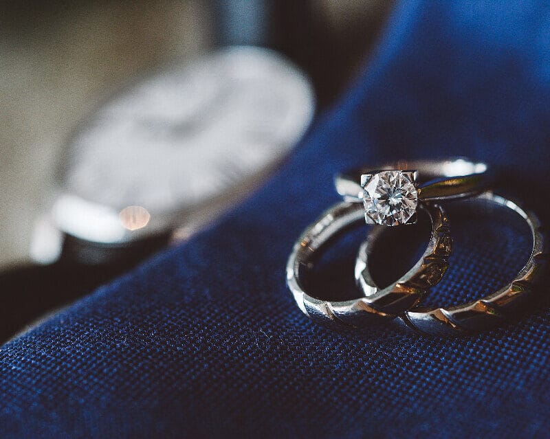 Two diamond engagement rings side by side