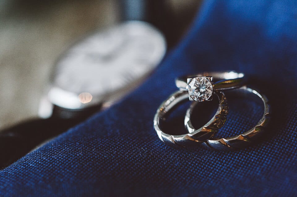 Two diamond engagement rings side by side