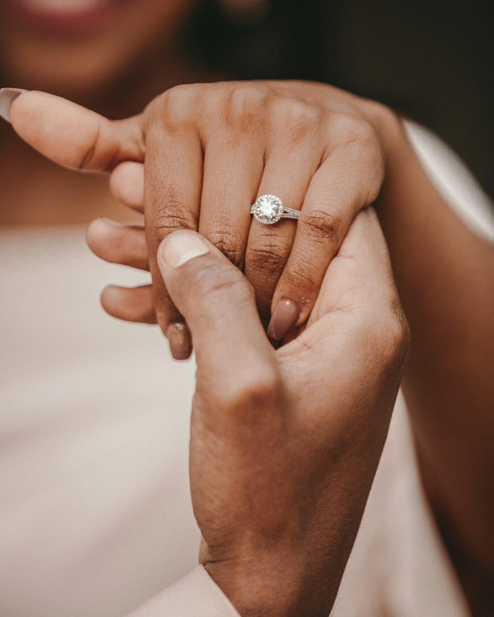 Diamond engagement ring worn close to the hand