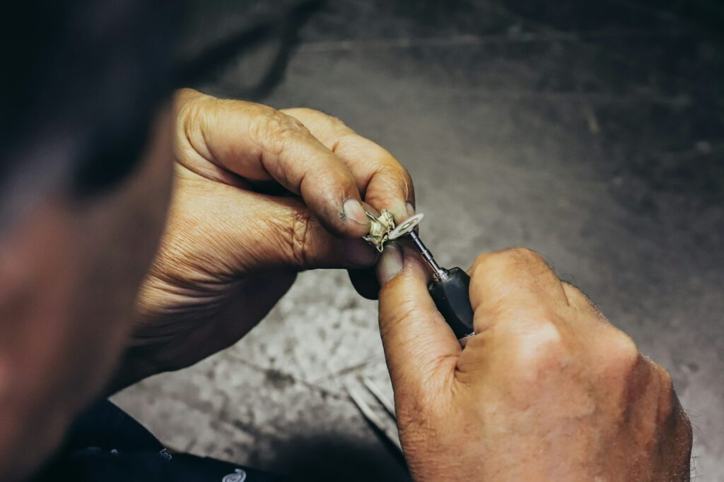 Setting a diamond by hand in the atelier