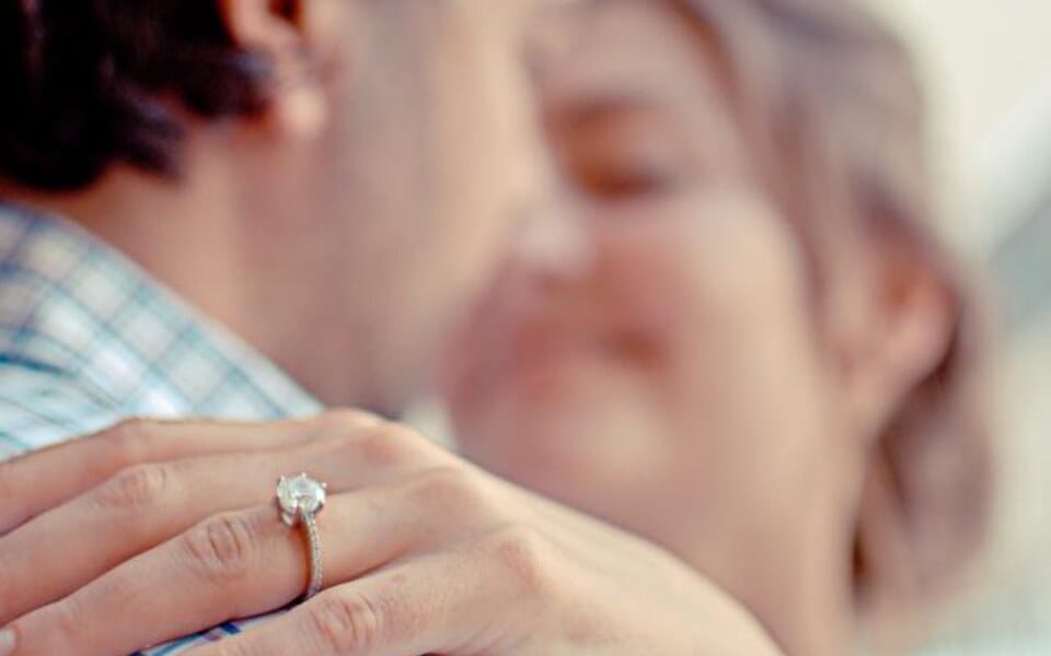 A couple embracing with an engagement ring — how to propose in Lebanon