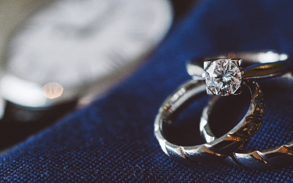 Two diamond engagement rings side by side — comparing lab-grown and natural diamonds