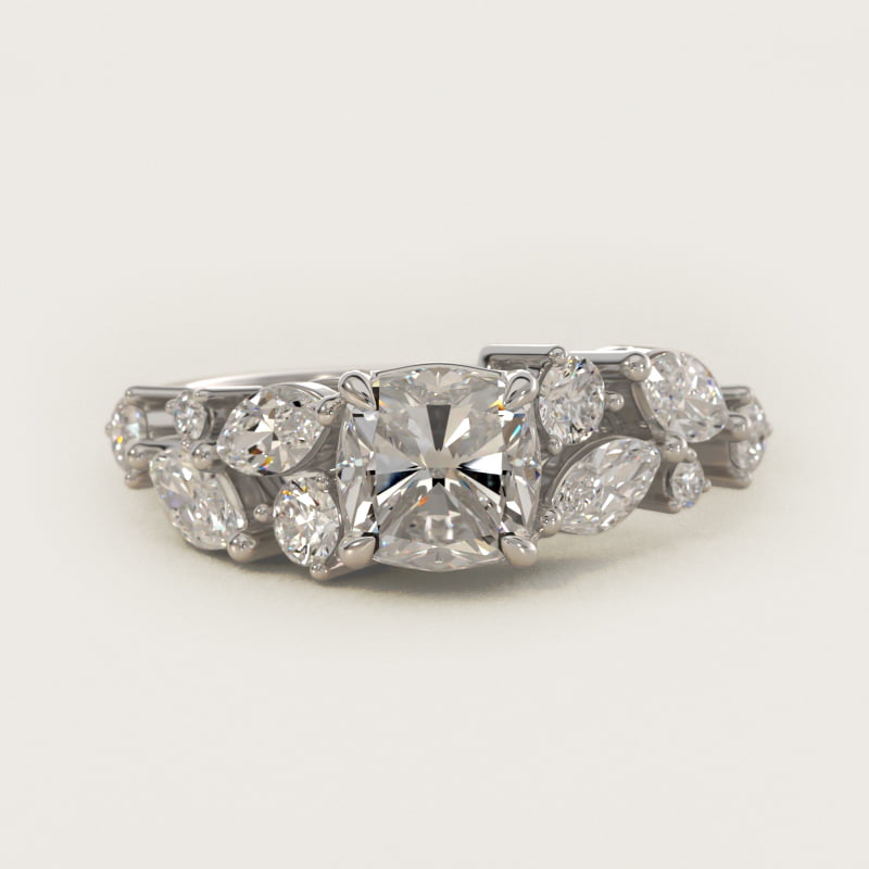 Bague taille coussin à pierres latérales en nid